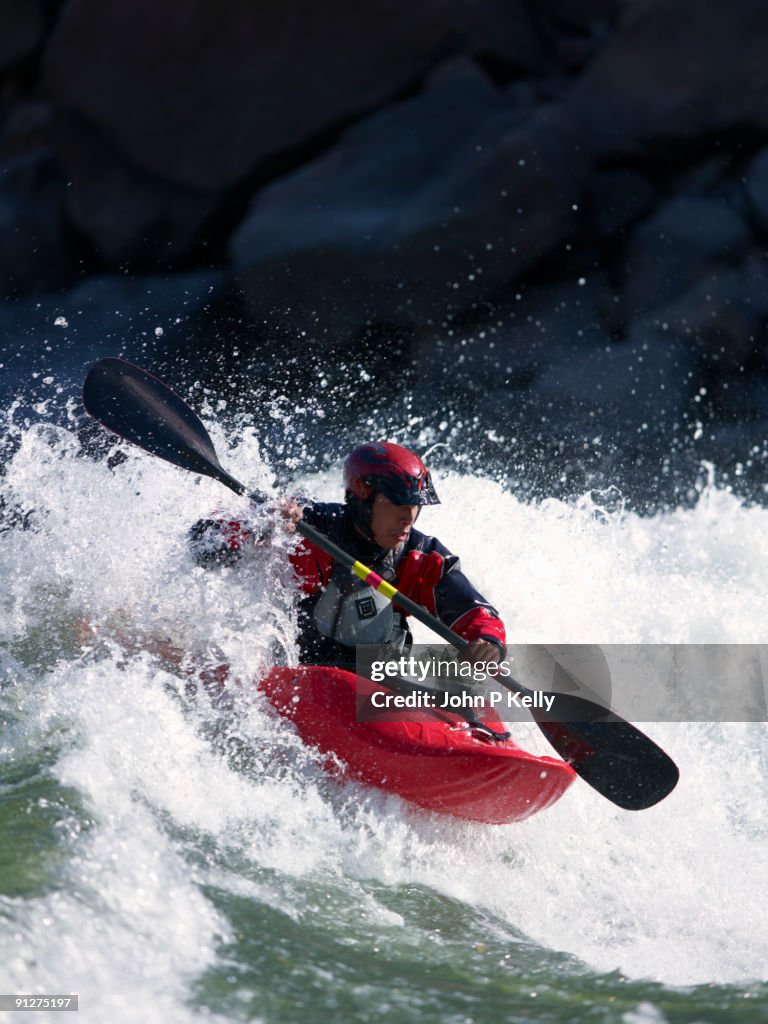 Whitewater freestyle kayaker