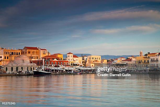 old harbor of chania and reflections in calm water - crete fotografías e imágenes de stock