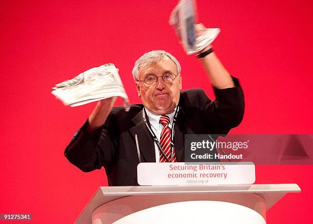 In this hand out photograph supplied by The Unite Union Tony Woodley Joint General Secretary of Unite tears up a copy of The Sun newspaper at the...