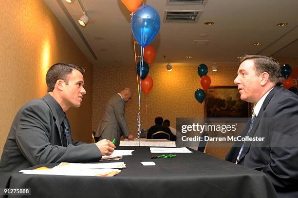 Area Retail Sales Manager Joshua Mailloux interviews a prospective employee at an AT&T job fair September 30, 2009 at the Hilton Dedham in Dedham,...