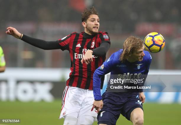 Dusan Basta of SS Lazio competes for the ball with Manuel Locatelli of AC Milan during the TIM Cup match between AC Milan and SS Lazio at Stadio...