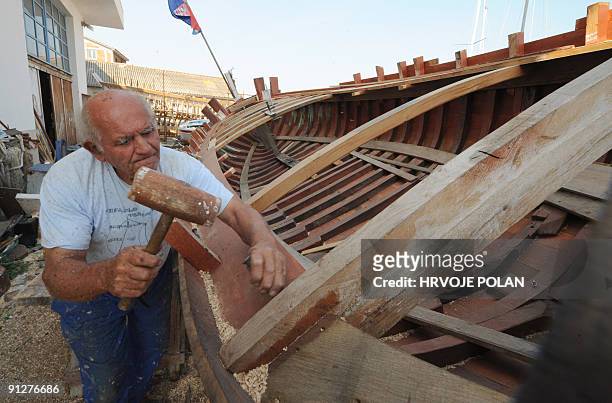 Cedomir Butina works on a traditional Croatian wooden boat named �gajeta� in his private small shipyard in the town of Betina, on Murter island, some...