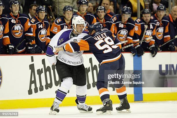 Rich Clune of the Los Angeles Kings fights with Michael Haley of the New York Islanders during the preseason game on September 22, 2009 at the Sprint...