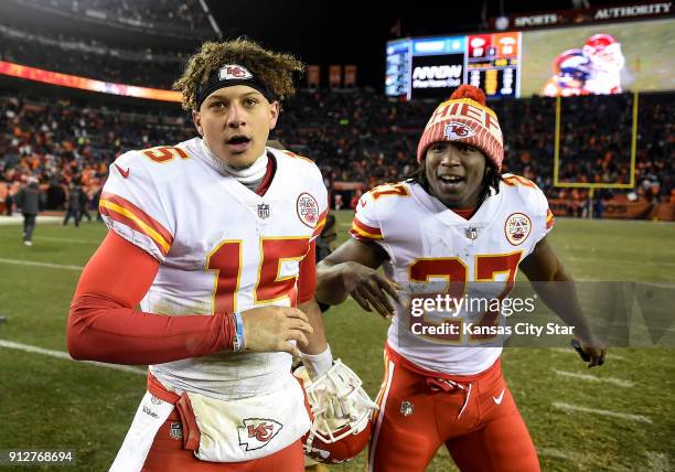 Kansas City Chiefs quarterback Patrick Mahomes is congratulated by running back Kareem Hunt after the Chiefs' 27-24 win against the Denver Broncos on...