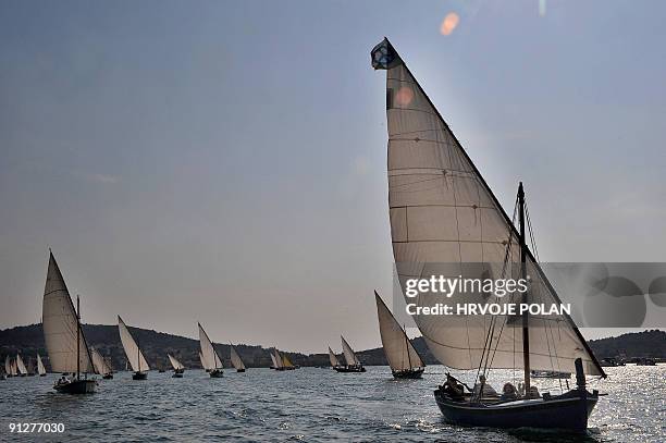 Participants of the 12th annual traditional Croatian wooden lateen sail boats regatta also named �gajetas�, sail past the Croatian central Adriatic...