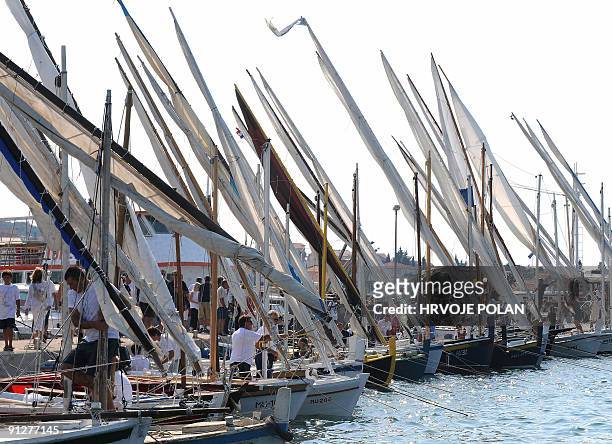 Participants of the 12th traditional Croatian wooden lateen sail boats regatta also named �gajetas�, are anchored off the Croatian central Adriatic...