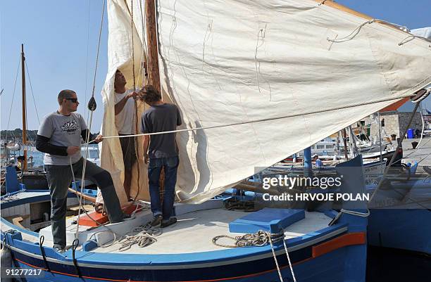 Crew of a traditional Croatian boat prepare for the 12th traditional Croatian wooden lateen sail boats regatta also named �gajetas�, sail past the...
