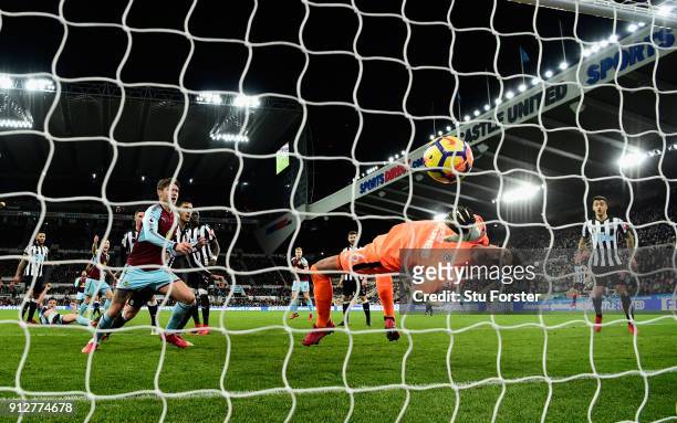 Newcastle goalkeeper Karl Darlow is beaten by a Sam Vokes header for the Burnley goal during the Premier League match between Newcastle United and...