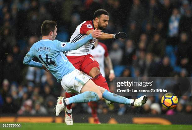 Matt Phillips of West Bromwich Albion shoots while under pressure from Aymeric Laporte of Manchester City during the Premier League match between...