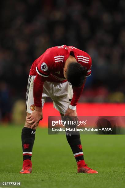 Alexis Sanchez of Manchester United reacts during the Premier League match between Tottenham Hotspur and Manchester United at Wembley Stadium on...