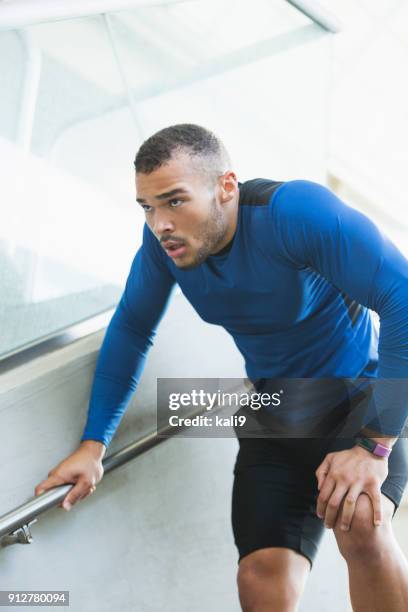 male athlete with knee injury - male knee stock pictures, royalty-free photos & images