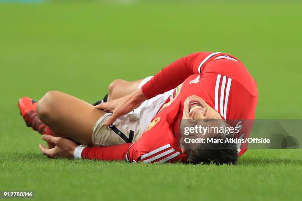 Alexis Sanchez of Manchester United reacts after being fouled during the Premier League match between Tottenham Hotspur and Manchester United at...