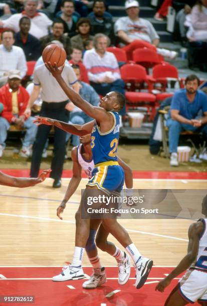 Mitch Richmond of the Golden State Warriors shoots against the Washington Bullets during an NBA basketball game circa 1989 at the Capital Centre in...