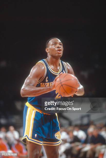 Mitch Richmond of the Golden State Warriors shoots a free throw against the Washington Bullets during an NBA basketball game circa 1990 at the...