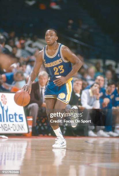 Mitch Richmond of the Golden State Warriors dribbles the ball up court against the Washington Bullets during an NBA basketball game circa 1990 at the...