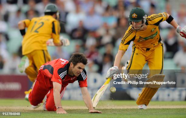 England bowler James Anderson attempts to field the ball as Australian batsmen Michael Clarke and Callum Ferguson take a run during the 1st NatWest...