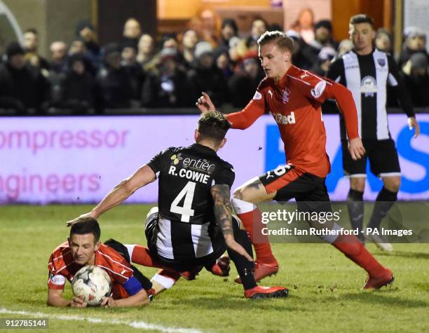 Rangers Jason Holt goes down in the box to win a penalty following a tackle from Fraserburgh's Ryan Cowie during the William Hill Scottish Cup,...