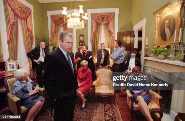 Presidential candidate George W Bush and his wife Laura Bush watches election returns with their family, the Cheneys and friends at the Texas...