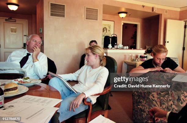 The morning after the election without a clear winner, vice presidential candidate Dick Cheney talks with daughters Liz and Mary Cheney, part of his...