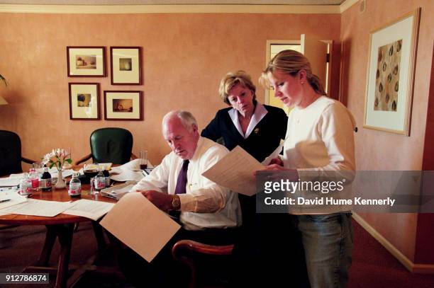 The morning after the election without a clear winner, vice presidential candidate Dick Cheney talks with his wife Lynne and daughters Liz and Mary...