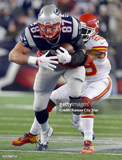 New England Patriots tight end Rob Gronkowski is stopped by Kansas City Chiefs free safety Eric Berry in the second quarter in the AFC divisional...