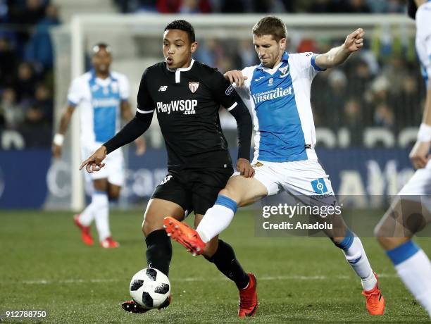 Luis Muriel of Sevilla in action against Darko Brasanac of Leganes during the Copa del Rey semi final match between Leganes and Sevilla at the...