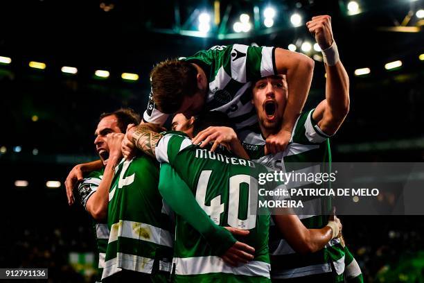 Sporting players celebrate after Sporting's French defender Jeremy Mathieu scored during the Portuguese league football match between Sporting CP and...