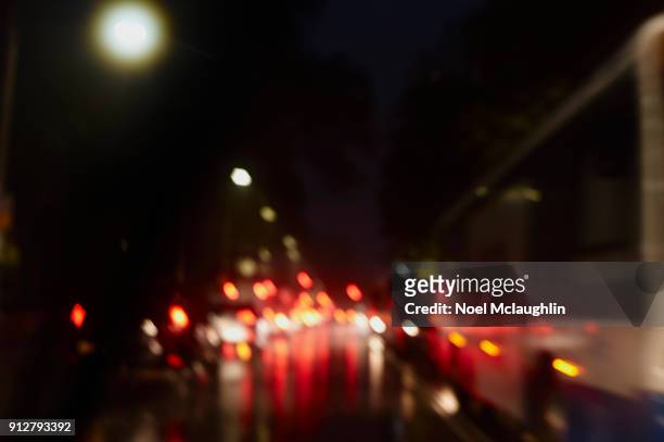 rush hour torrential rain sydney - australian bus driver stock-fotos und bilder