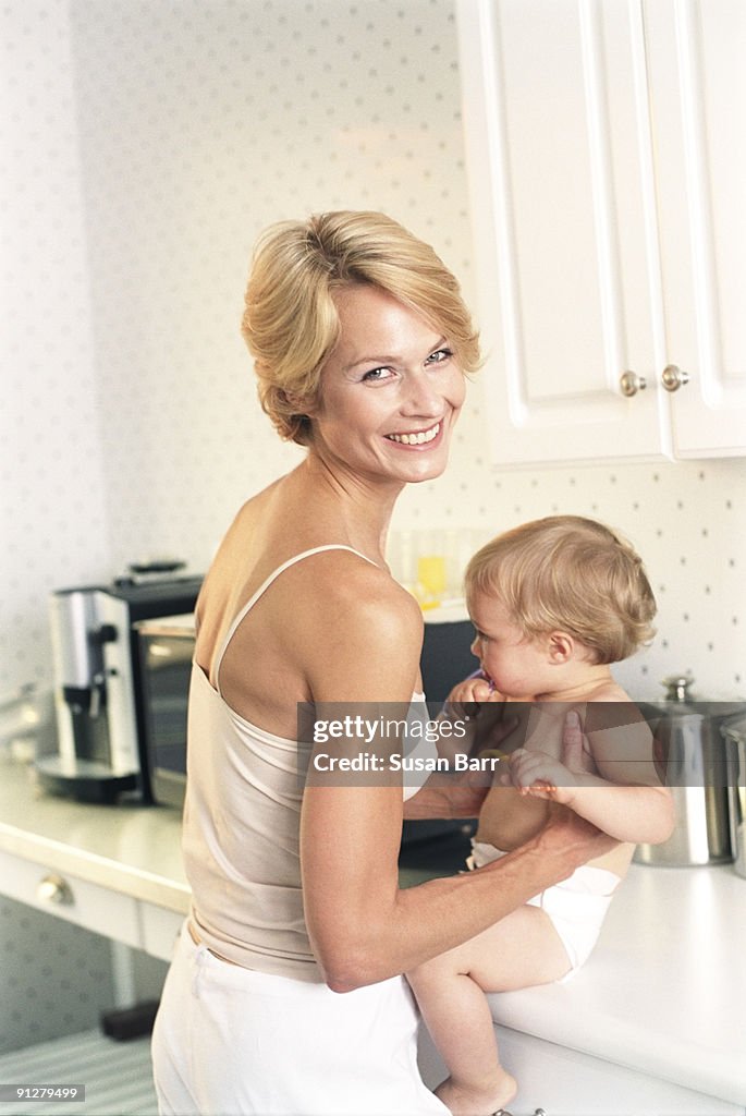 Mother and baby in kitchen