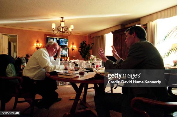 The morning after the election without a clear winner, vice presidential candidate Dick Cheney talks with Congressman Rob Portman in his suite at the...