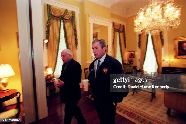 Texas Governor George W Bush talks with his running mate Dick Cheney at the Governor's Mansion the morning after the election that was too close to...