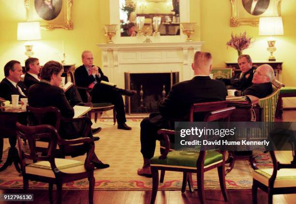 Texas Governor George W Bush talks with running mate Dick Cheney and advisers Karen Hughes, Don Evans, Karl Rove, Joe Allbaugh, and Andrew Card at...