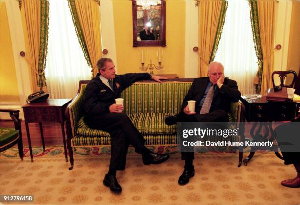 Texas Governor George W Bush talks with his running mate Dick Cheney at the Governor's Mansion the morning after the election that was too close to...