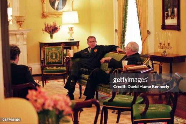 Texas Governor George W Bush talks with his running mate Dick Cheney at the Governor's Mansion the morning after the election that was too close to...