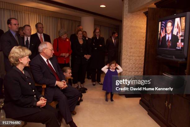 Vice President-elect Dick Cheney with his wife Lynne, other family and supporters watch to Vice President Al Gore on television concede the election...