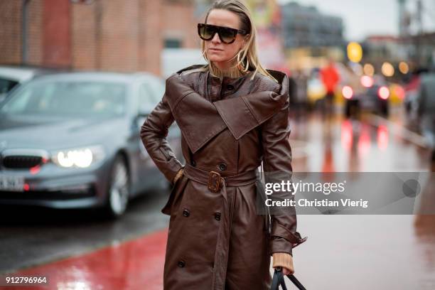 Celine Aagaard wearing brown leather coat, white boots outside Freya Dalsjo during the Copenhagen Fashion Week Autumn/Winter 18 on January 31, 2018...