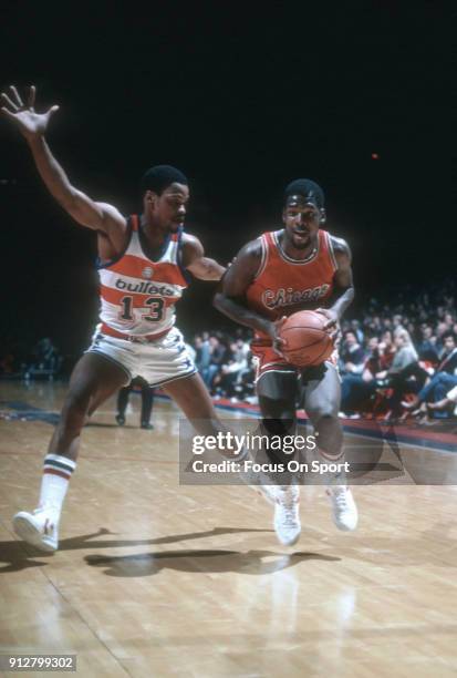 Quintin Dailey of the Chicago Bulls looks to drive on Bryan Warrick of the Washington Bullets during an NBA basketball game circa 1982 at the Capital...