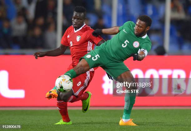 Nigeria's Kalu Orji Okogbue vies for the ball with Sudan's Saifeldin Malik Bakhit Maki during their African Nations Championship semifinal match at...