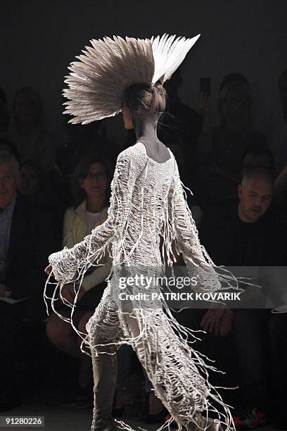 Model presents an outfit by British designer Gareth Pugh during ready-to-wear spring-summer 2010 fashion show in on September 30, 2009 in Paris. AFP...