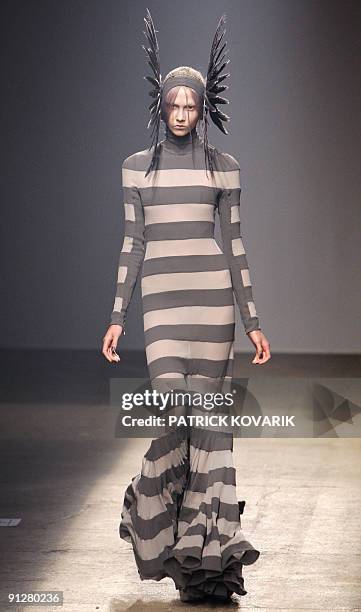 Model presents an outfit by British designer Gareth Pugh during ready-to-wear spring-summer 2010 fashion show in on September 30, 2009 in Paris. AFP...