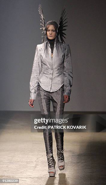 Model presents an outfit by British designer Gareth Pugh during ready-to-wear spring-summer 2010 fashion show in on September 30, 2009 in Paris. AFP...