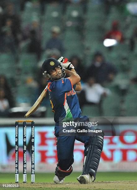 Virat Kohli of India hits a six off David Bernard of the West Indies to reach his 50 during The ICC Champions Trophy Group A Match between India and...