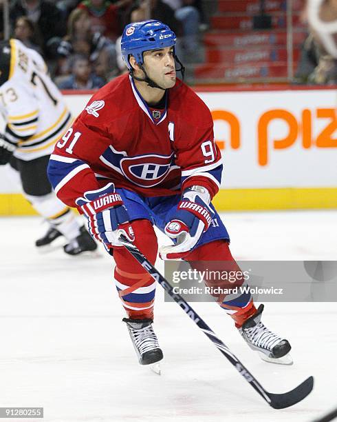 Scott Gomez of the Montreal Canadiens skates on the forecheck during the NHL preseason game against the Boston Bruins on September 24, 2009 at the...