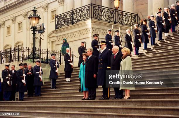On Inauguration Day, President George W Bush, First Lady Laura Bush, Vice President Dick Cheney, and Lynne Cheney stand on the steps of the US...