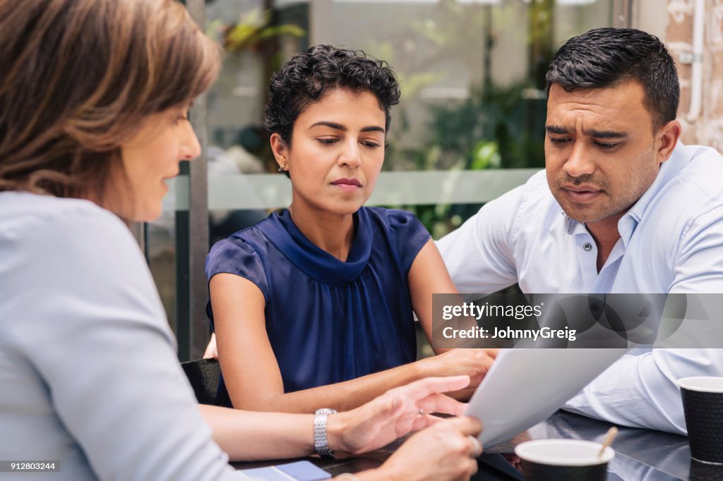 Serious couple receive professional advice