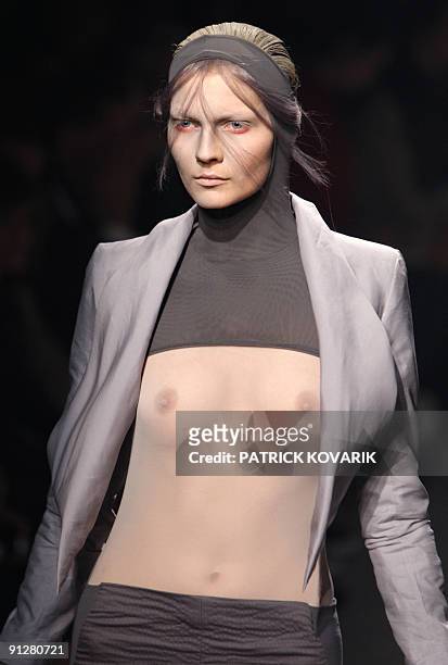 Model presents an outfit by British designer Gareth Pugh during ready-to-wear spring-summer 2010 fashion show in on September 30, 2009 in Paris. AFP...