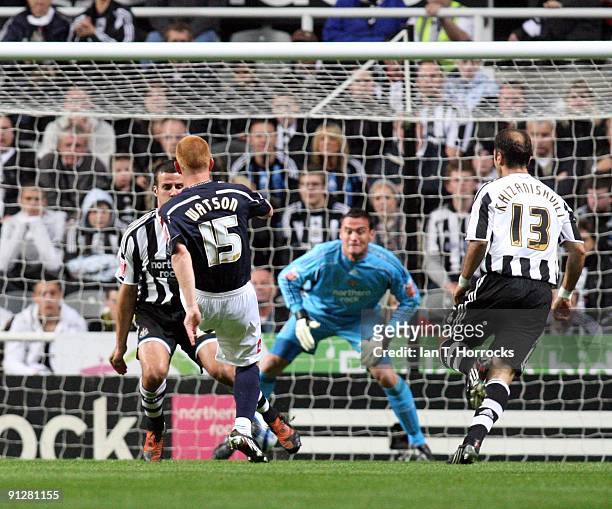 Ben Watson scores the opening goal with a shot deflecting off Steven Taylor during the Coca-Cola Championship match between Newcastle United and...
