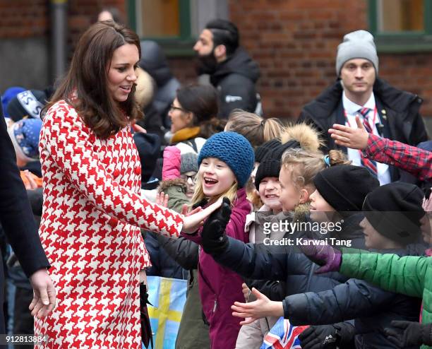 Catherine, Duchess of Cambridge departs from Matteusskolan School after visiting children who have taken part in the YAM programme during one of...