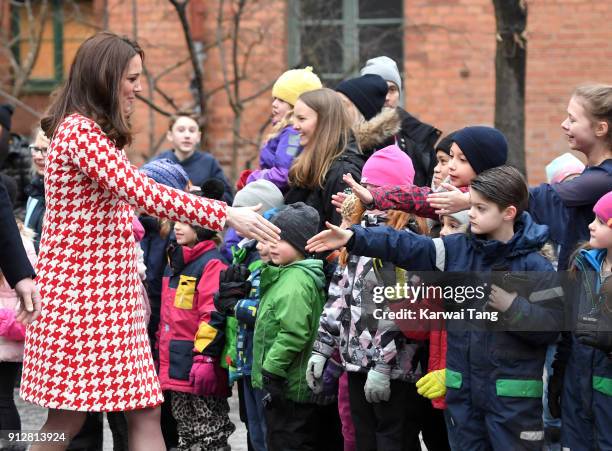 Catherine, Duchess of Cambridge departs from Matteusskolan School after visiting children who have taken part in the YAM programme during one of...