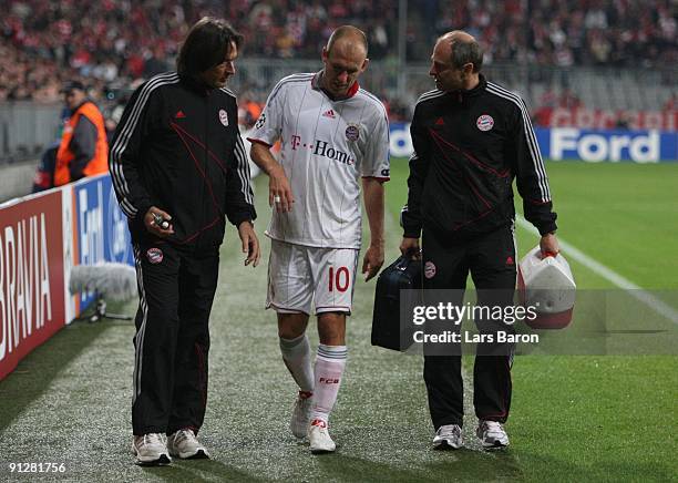 Arjen Robben of Bayern leaves the pitch after picking an injury during the UEFA Champions League Group A match between FC Bayern Muenchen and...